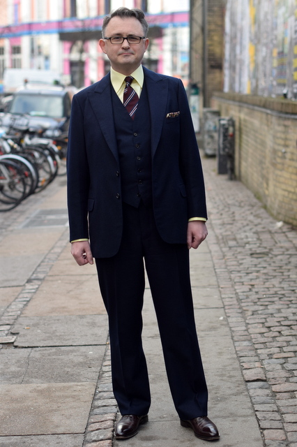 blue suit and yellow shirt