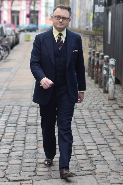 blue suit and yellow shirt