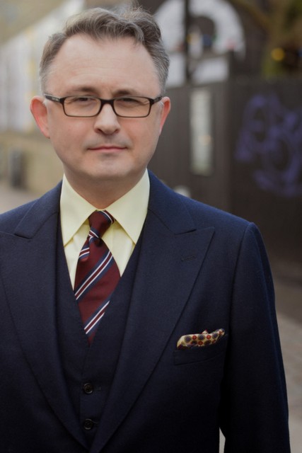 blue suit and yellow shirt